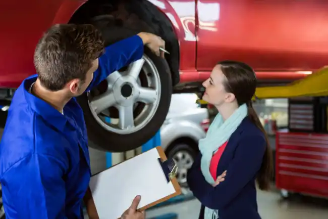 mechanic orienting a client for preventive maintenance